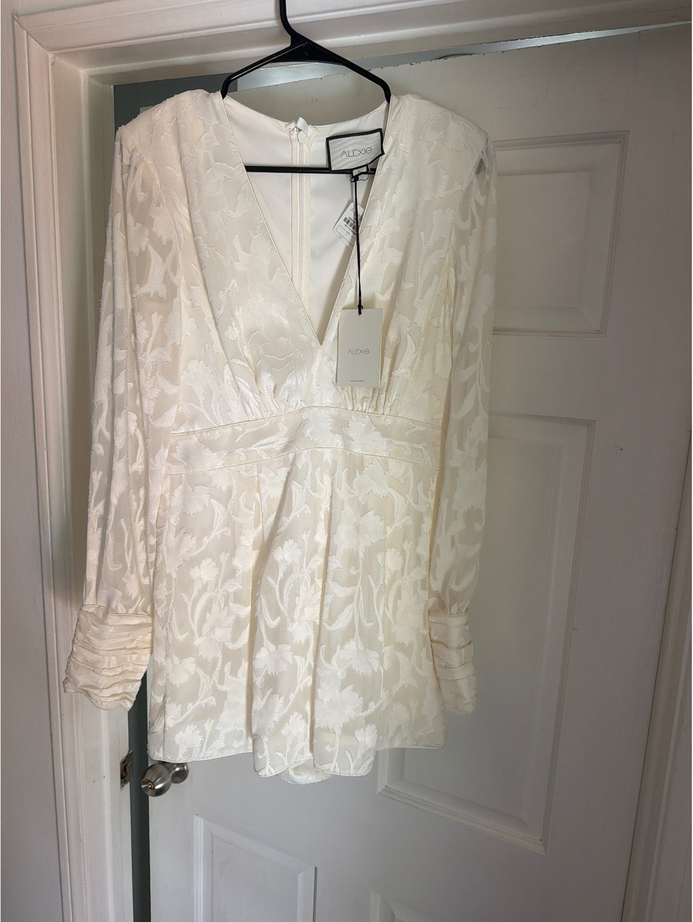 Alexis was ivory Jacquard V-Neck Long Sleeve Romper with Buttoned Cuffs